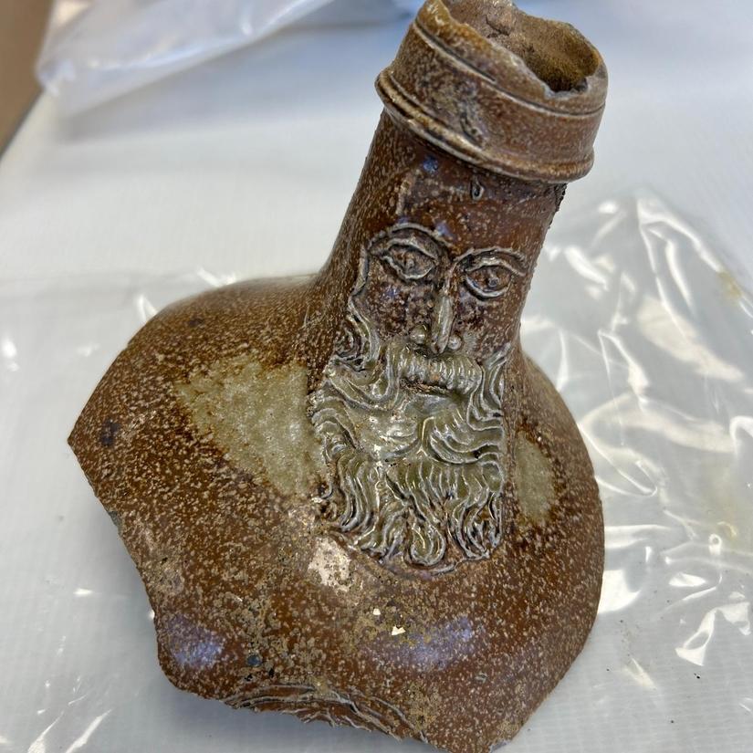 Close up photo of the top of a Bartmann jug