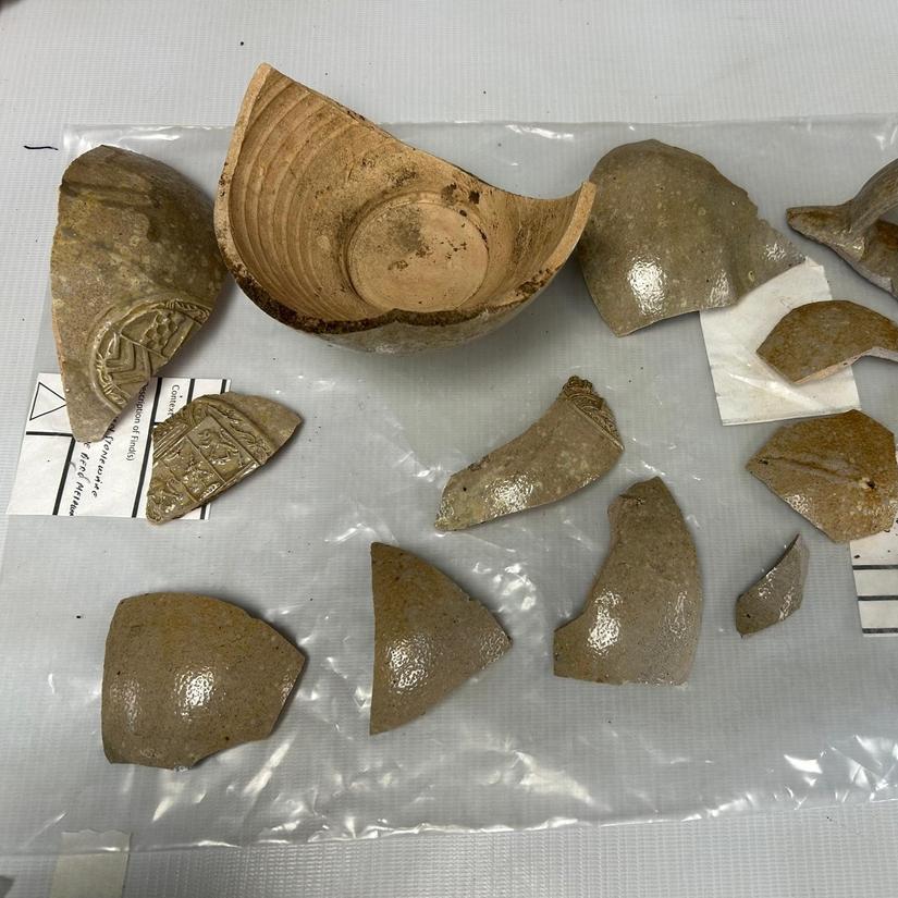 Fragments of bartmann jugs laid out on a table