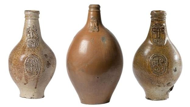 Three bartmann jugs in a row