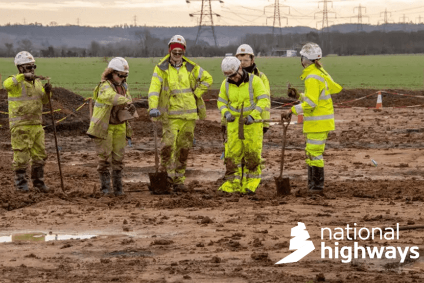 A team of archaeologists pose for a group photograph