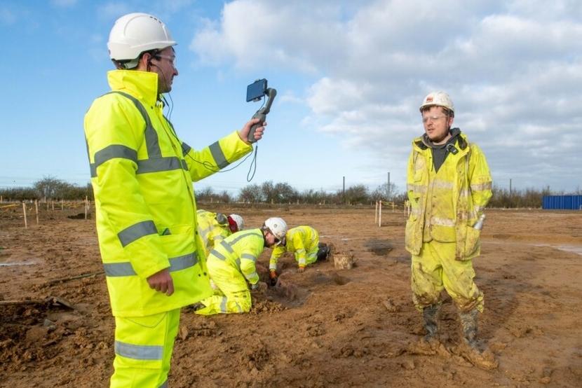 Filming an archaeologist during A428 excavations