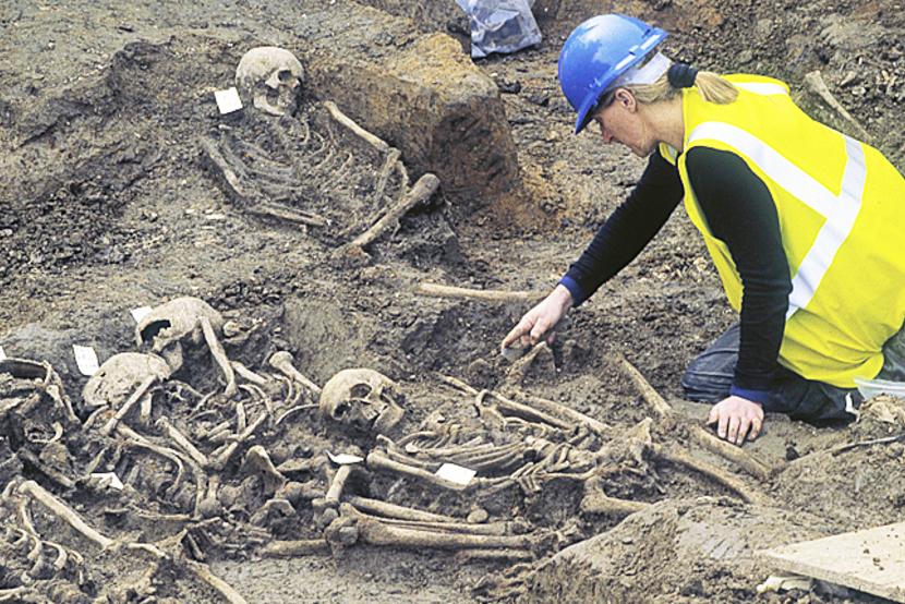 MOLA archaeologists excavating burial pit