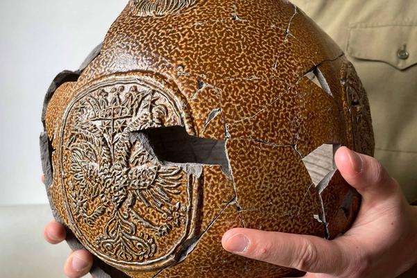 The reconstructed jug with a couple of empty spaces where pieces have never been found.