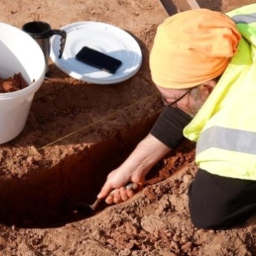 Archaeologist taking a soil sample