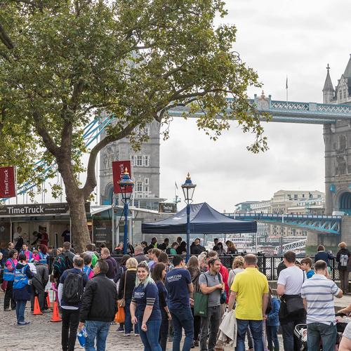 Crowd of people exploring archaeology near Tower Bridge London