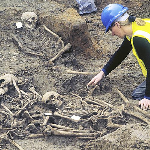 MOLA archaeologists excavating burial pit