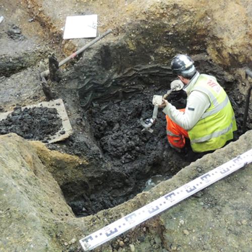 MOLA archaeologist excavating the wattle pit 